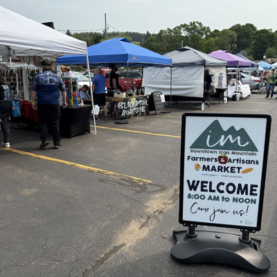 downtown iron mountain farmers artisans market welcome sign